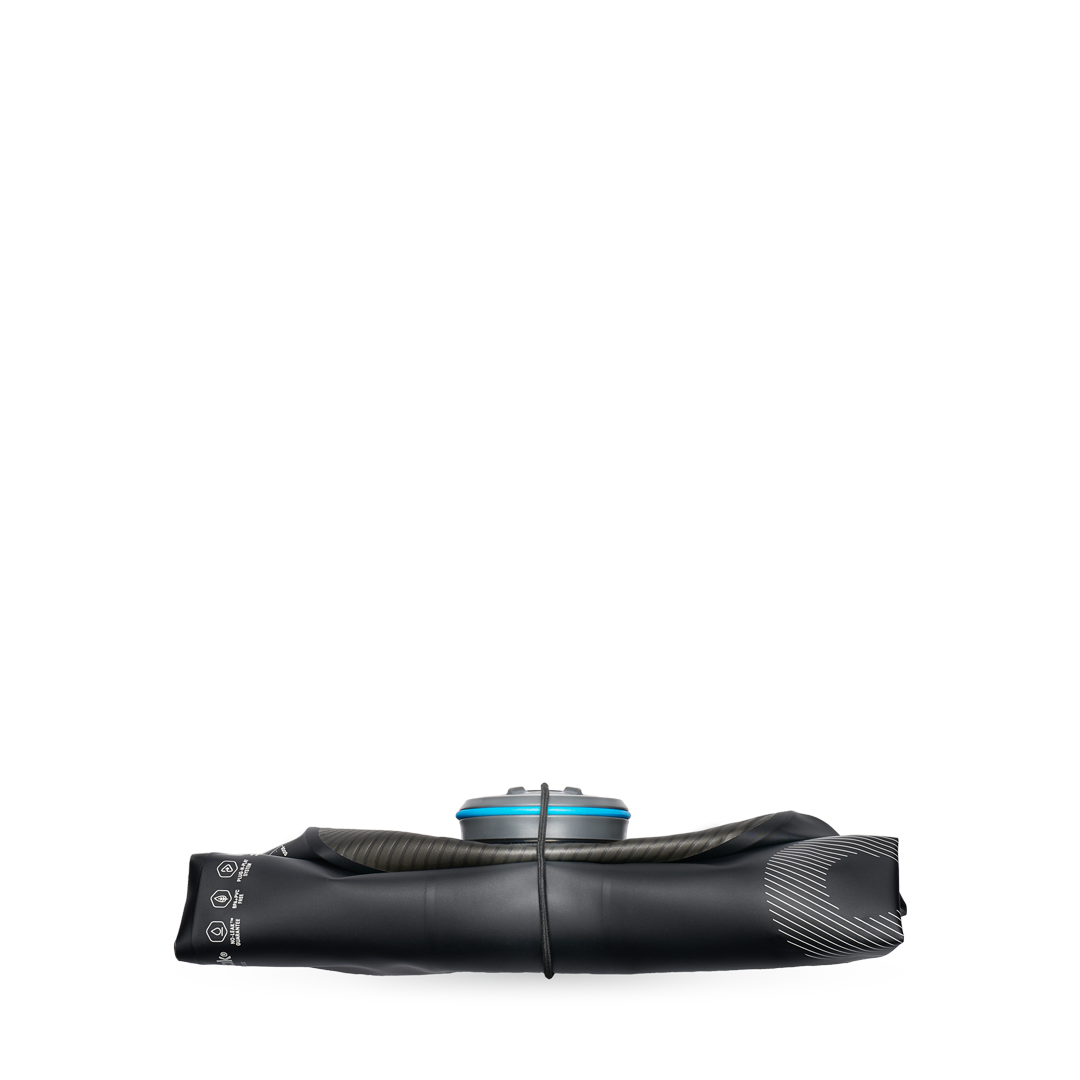 Side view of black HydraPak 8 litre expedition water storage bladder shown flattened with band holding it folded.