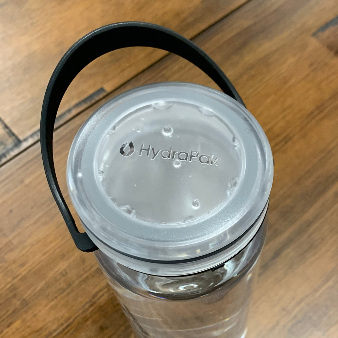 Close up of HydraPak Recon leakproof Flat Cap on a Recon bottle with a bail handle Colour: Clear / Black